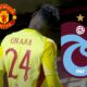 The back of Andre Onana pictured next to the club logos of Man United and Trabzonspor