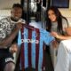 Andre Onana and wife Melanie Kamayou pictured holding a Trabzonspor shirt on a private jet