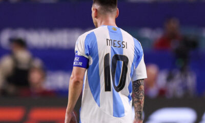 Lionel Messi, pictured from behind with the No 10 on the back of his Argentina shirt on show