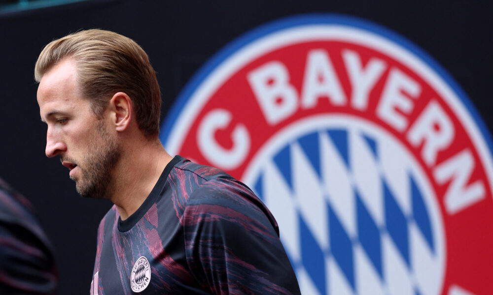 Harry Kane next to a giant Bayern Munich badge at the Club World Cup