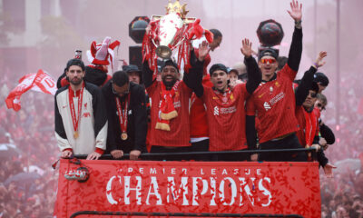 Liverpool players pictured parading their Premier League trophy on an open-top bus after winning the title in the 2024-25 season