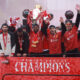 Liverpool players pictured parading their Premier League trophy on an open-top bus after winning the title in the 2024-25 season