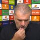 Ange Postecoglou pictured holding his lip during a TNT Sports interview after Nottingham Forest lost 3-2 to FC Midtjylland
