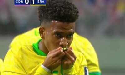 Estevao Willian kisses the Brazil badge on his shirt after scoring against South Korea in a 5-0 win in October 2025
