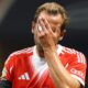 Bayern Munich striker Harry Kane pictured covering his face with his hand