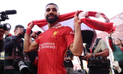 Mo Salah pictured holding a Liverpool scarf