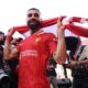 Mo Salah pictured holding a Liverpool scarf