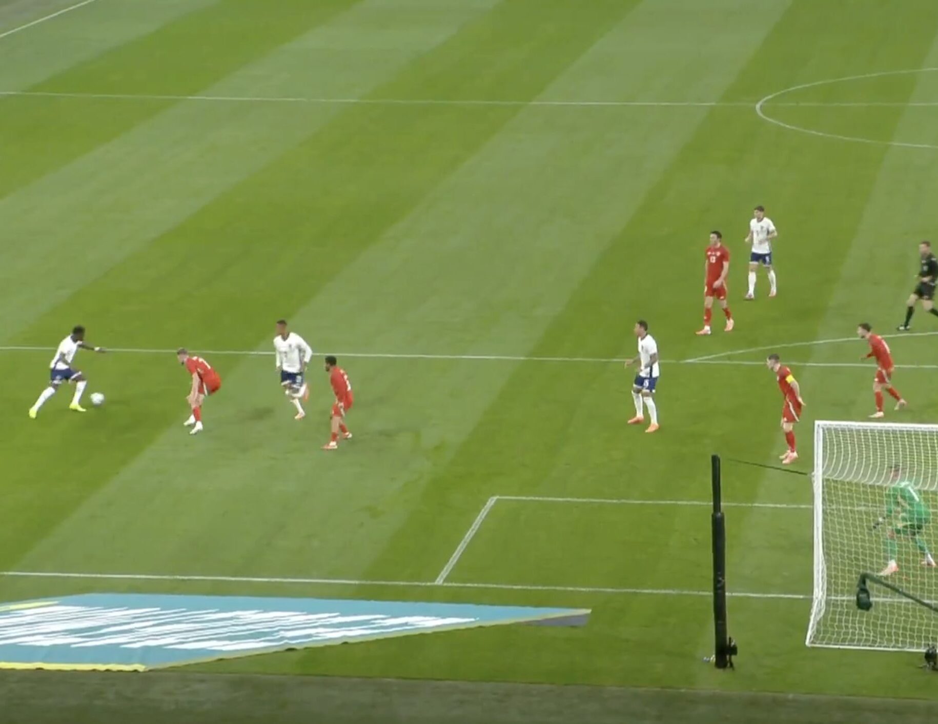 Bukayo Saka pictured (left) seconds before scoring a stunning solo goal for England against Wales