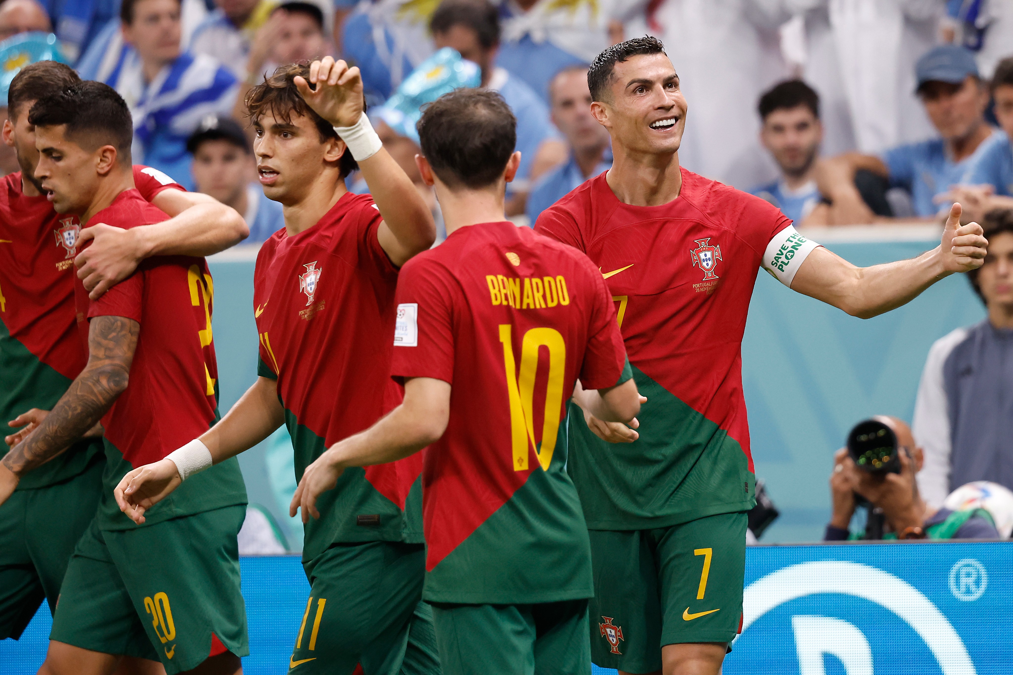 Cristiano Ronaldo (right) pictured celebrating a goal at the 2022 World Cup