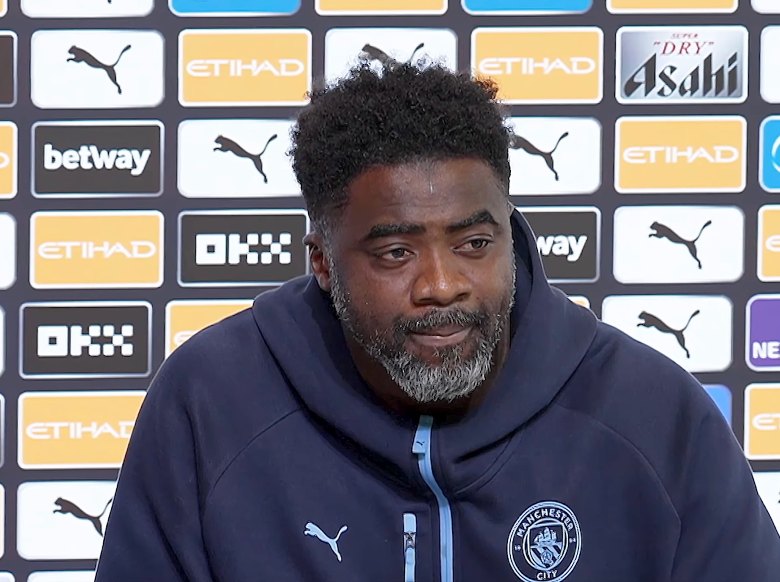 Kolo Toure pictured hosting a Man City press conference