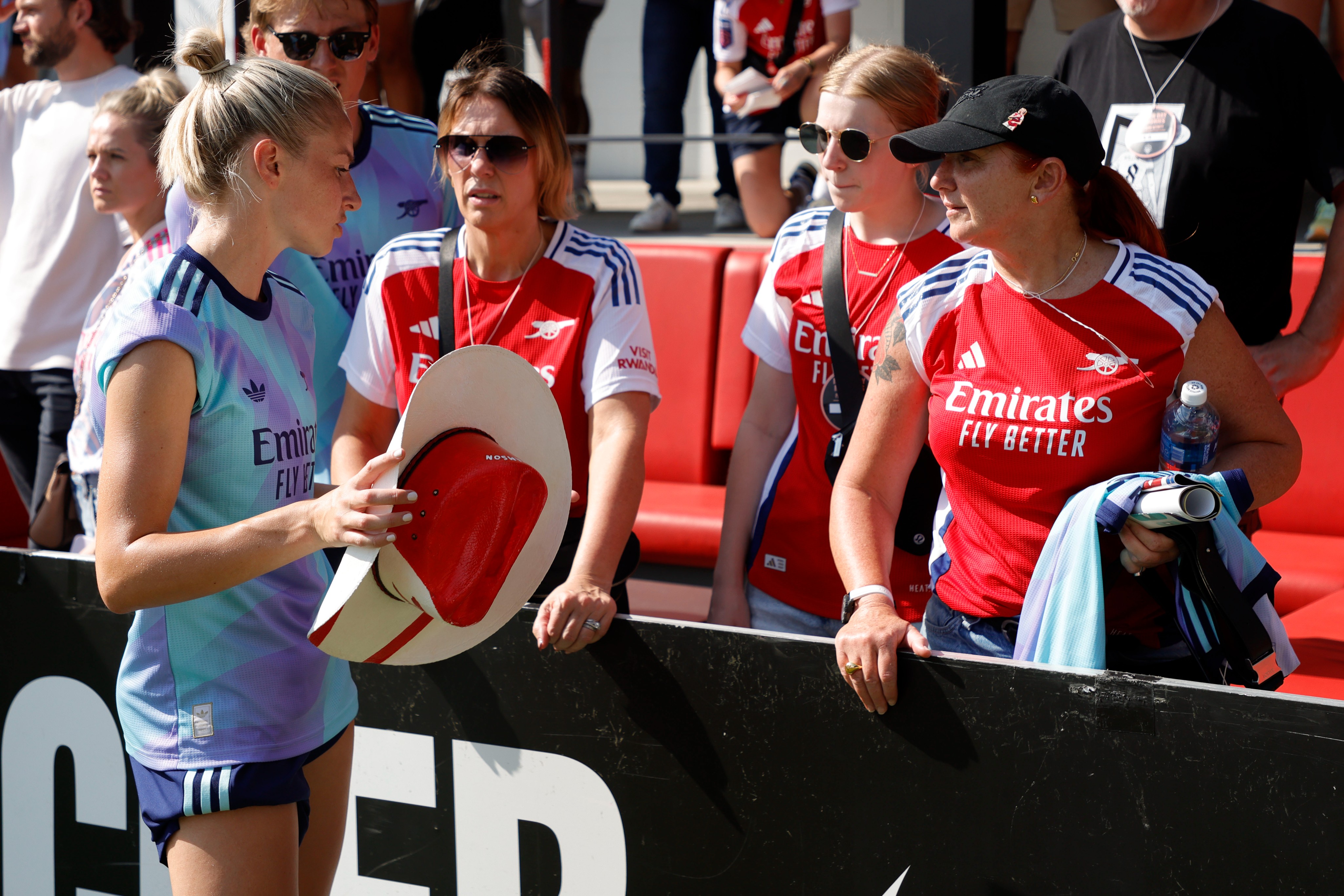 Leah Williamson (left) pictured speaking with Arsenal fans