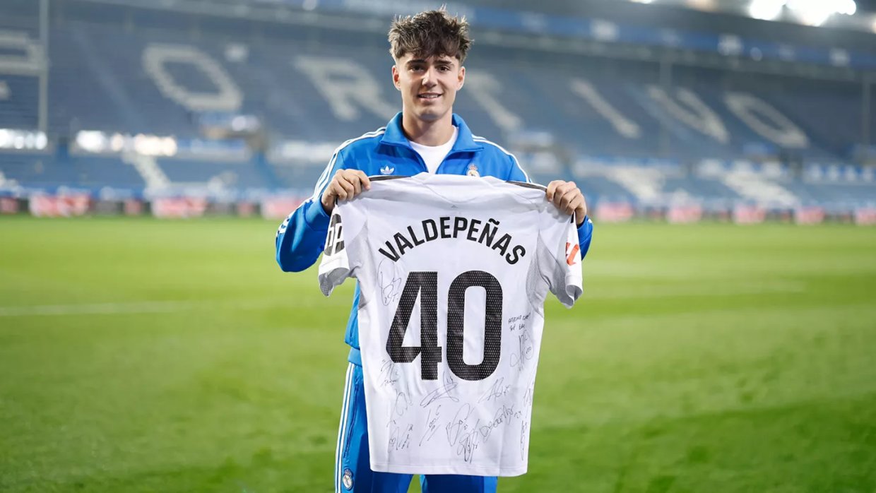 Victor Valdepenas Holding the Real Madrid Jersey He Debuted With
