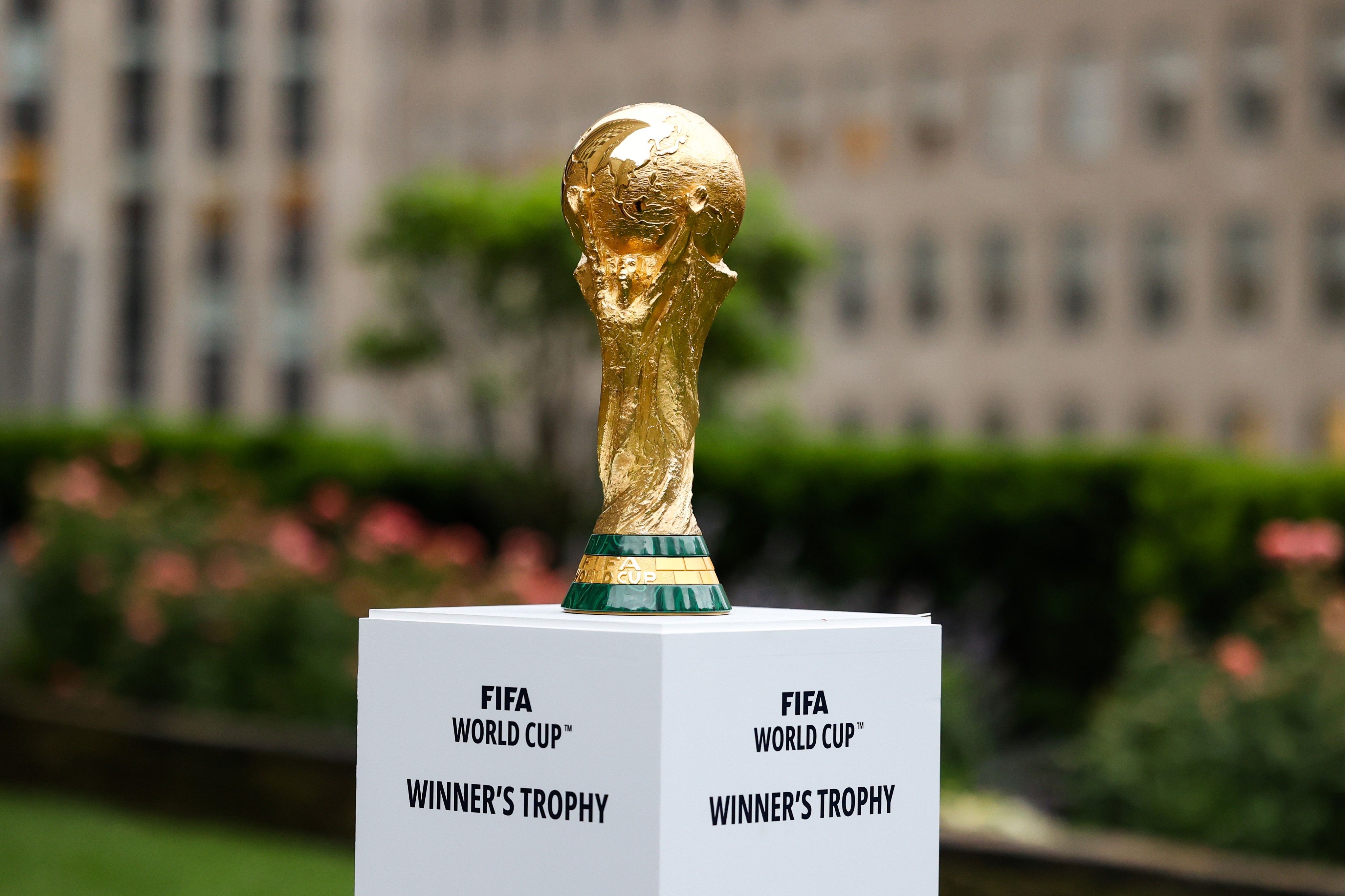 The FIFA World Cup trophy pictured on a stand in New York