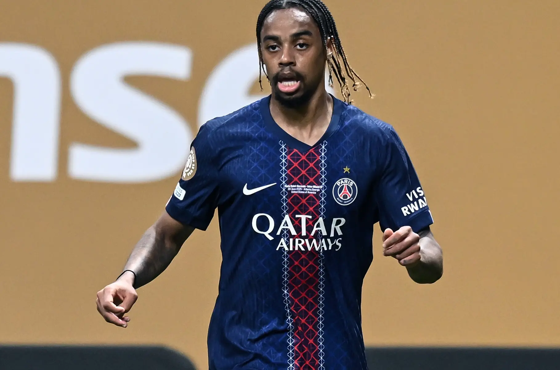 Bradley Barcola wearing PSG jersey during a match, with blue and red design.