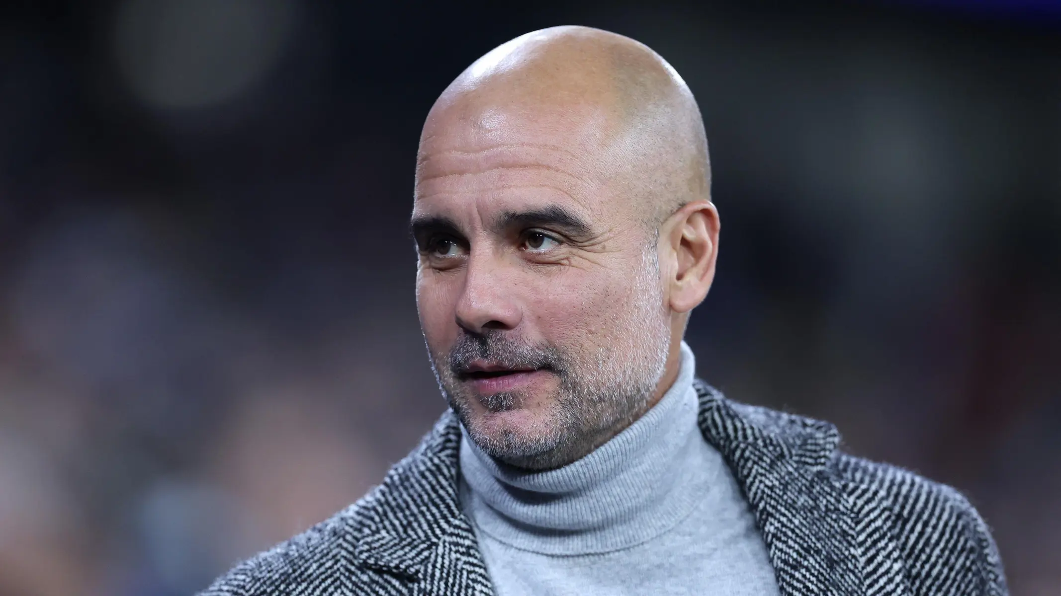 Pep Guardiola, Manchester City manager, during a match with a focused expression.