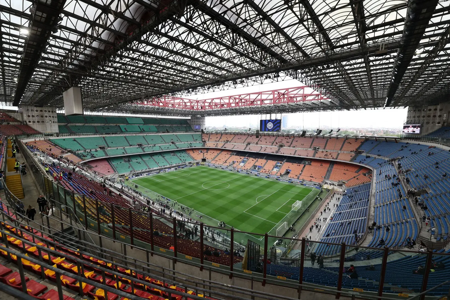 Interior view of San Siro stadium, home of Inter Milan, showing empty stands and the pitch.